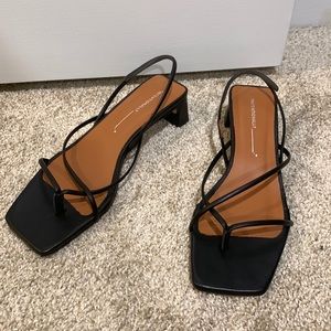 Black leather strappy kitten sandals revolve